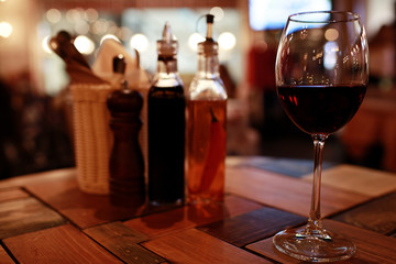 Serving a glass of red wine in a restaurant