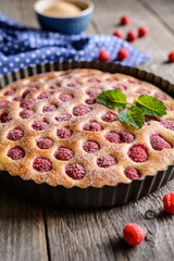 Juicy raspberry pie with powdered sugar icing