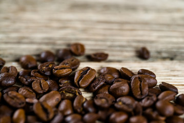Coffee beans on wood background