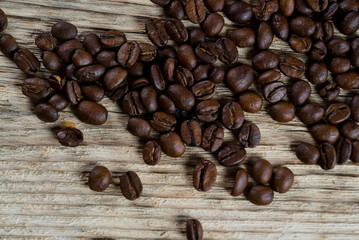 Coffee beans on wood background