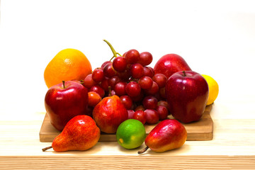 Fresh fruits. Mixed fruits. Healthy diet, diet, love of fruit, lie on a wooden tray