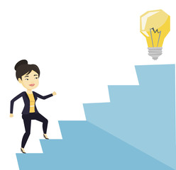 Fototapeta premium Business woman walking upstairs to the idea bulb.