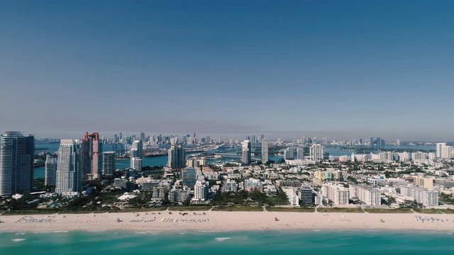 Aerial view: Miami south beach establishing shot, forward motion 