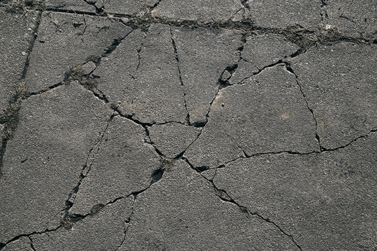 Asphalt with cracks. cracked asphalt road surface texture. 