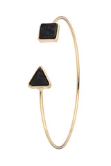 Gold bracelet with two abstract black semiprecious stones, isolated on white background, clipping path included