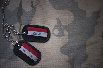army blank, dog tag with flag of iraq and syria on the khaki texture background. military concept