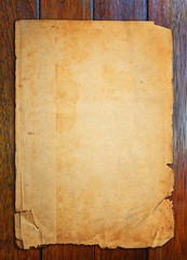 Fototapeta na wymiar Old paper on wood table.