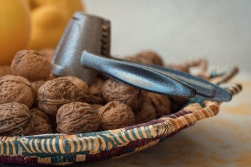 walnuts and nutcracker in basket