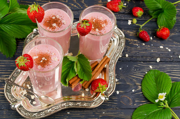 Strawberry smoothie on a wooden table
