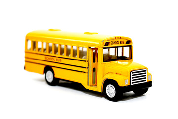 Yellow school bus kids toy on white background