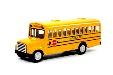 Yellow school bus kids toy on white background