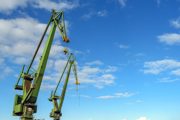 Big cranes in the shipyard. Gdansk, Poland. - obrazy, fototapety, plakaty