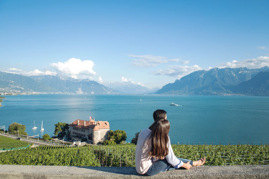 Couple on holiday looking at a beautiful mountain view