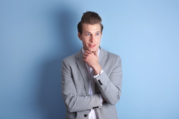 Handsome young man on color background
