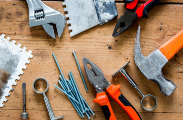 building implements set for repair on wooden background top view