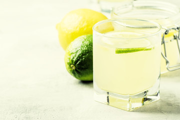 Jelly with lemon and lime in a glass, gray background, selective focus