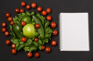 Naklejka na ściany i meble Healthy eating, dieting, slimming and weigh loss concept. Vegetables, greenery and сherry tomatoes on dark wooden background with space for text. Diet concept. 