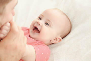 Adorable baby with young father, closeup