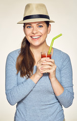 Young woman holding glass with vitamin drink.