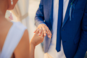 The newlyweds exchange rings at a wedding in Montenegro.