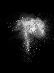 Cloud of flour on dark background