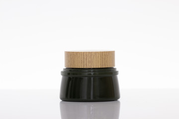 Jar of face cream isolated on white background with reflection