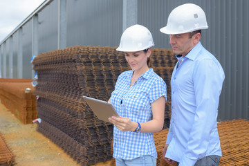 Man and woman in materials yard