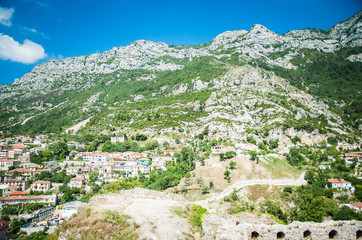 Fototapeta na wymiar 2016, Albania, Kruja. Beautiful view to the city and moutains. Blue sky and green landscape