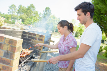 Couple having a barbeque