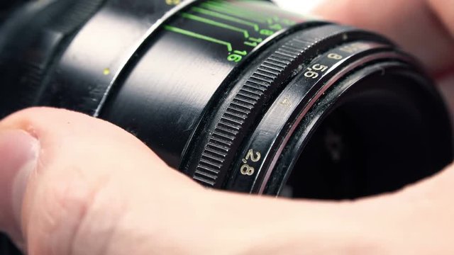 Photographer Zooming and Adjusts the Aperture in the Retro Camera. 4K