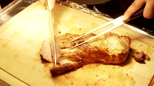 of a beef steak. Cutting in a restaurant for the guest