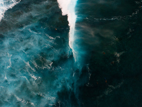 Aerial view of swimmers in choppy sea, Teahupoo, Tahiti, South Pacific