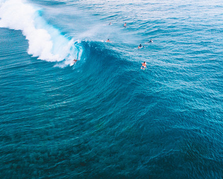 Aerial view of surfers surfing in ocean