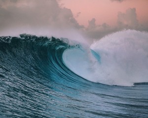 Large scale wave at sunset, Tahiti, South Pacific