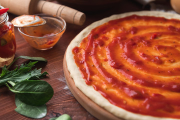 Step-by-step boss makes a pizza margarita. Dough and pizza ingredients