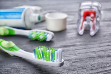 Toothbrush on wooden background, closeup