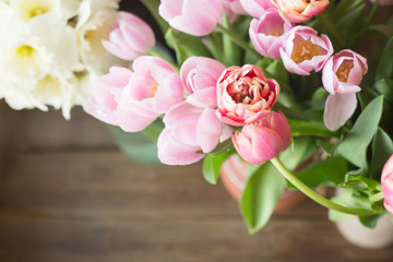 Pink tulips on the wooden background. Pink tulip. Tulips. Flowers. Flower background. Flowers photo concept. Colored tulips. Petals. Narcissus