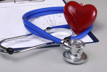 RX prescription, Red heart and a stethoscope on white background..