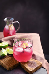 Glass with delicious wine spritzer on wooden board