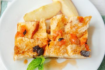 Delicious bread pudding with fruits on plate