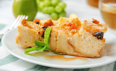 Delicious bread pudding with fruits on plate