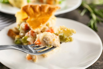 Delicious chicken pot pie on plate, closeup
