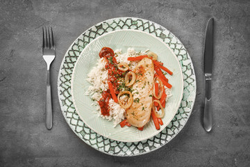 Chicken breast with rice served for dinner on table