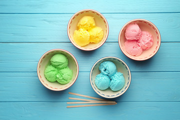Ice cream collection in bowls on wooden background