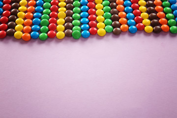 Colorful candies on color background