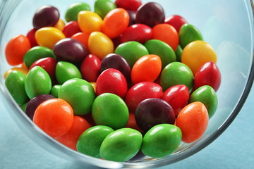 Delicious colorful candies in bowl, closeup