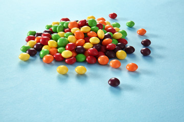 Colorful candies on color background