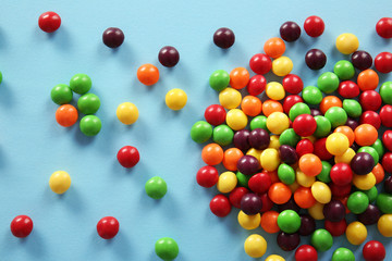 Obraz premium Colorful candies on color background