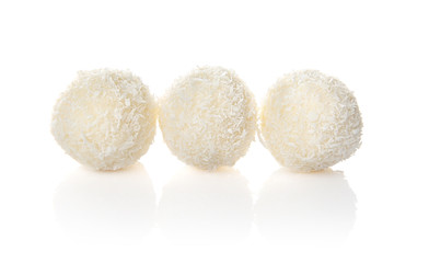 Coconut candies on white background