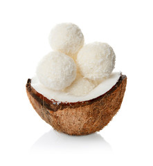 Coconut candies in nut on white background
